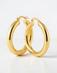 Sophia Schneider Joyas 14K yellow gold tubular hoop earrings, 5mm thick, 3.4cm diameter.