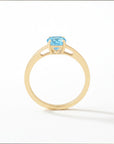 Sophia Schneider Joyas 18K gold ring with a 0.96 ct oval blue topaz gemstone.