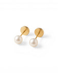 Sophia Schneider Joyas 18K yellow gold screw-back earrings with dangling white pearls.