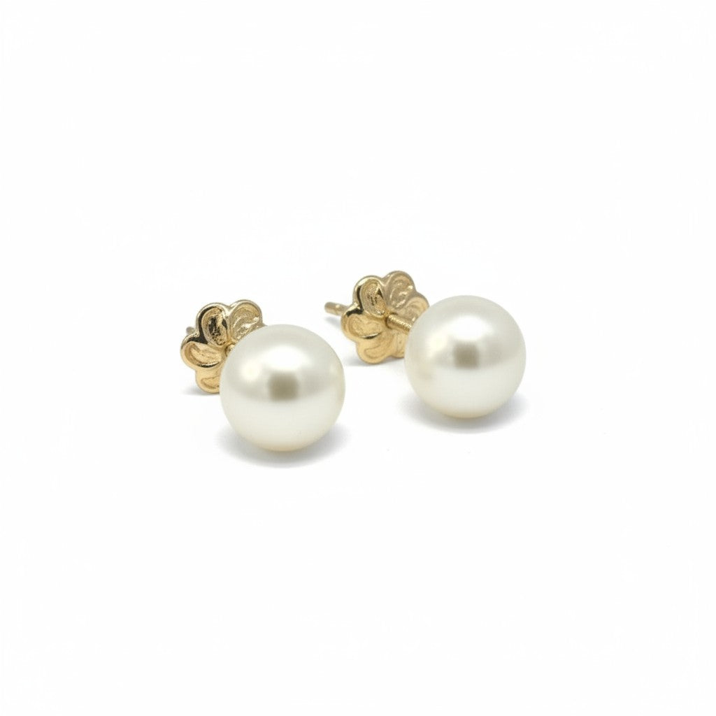 Sophia Schneider Joyas 18K yellow gold screw-back earrings with lustrous white pearls.