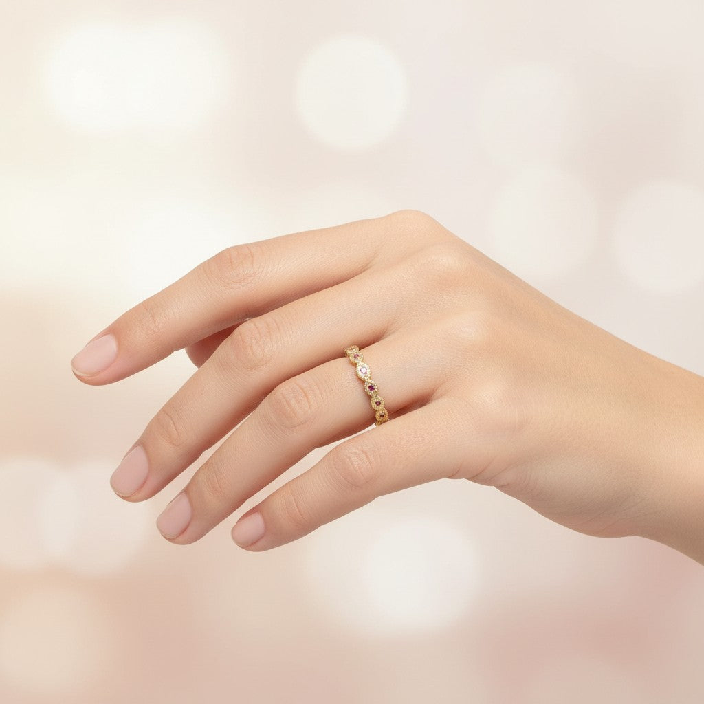 Sophia Schneider Joyas 18K yellow gold band ring with small round rubies set in a scalloped bezel setting.