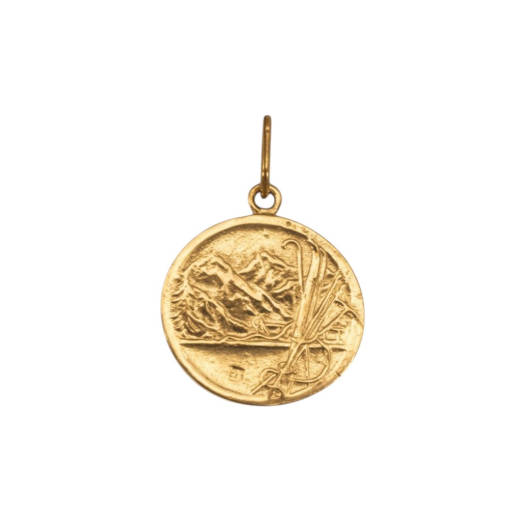 Sophia Schneider Joyas 18K gold St. Bernard medal, 17mm, depicting the saint with mountains and inscription.
