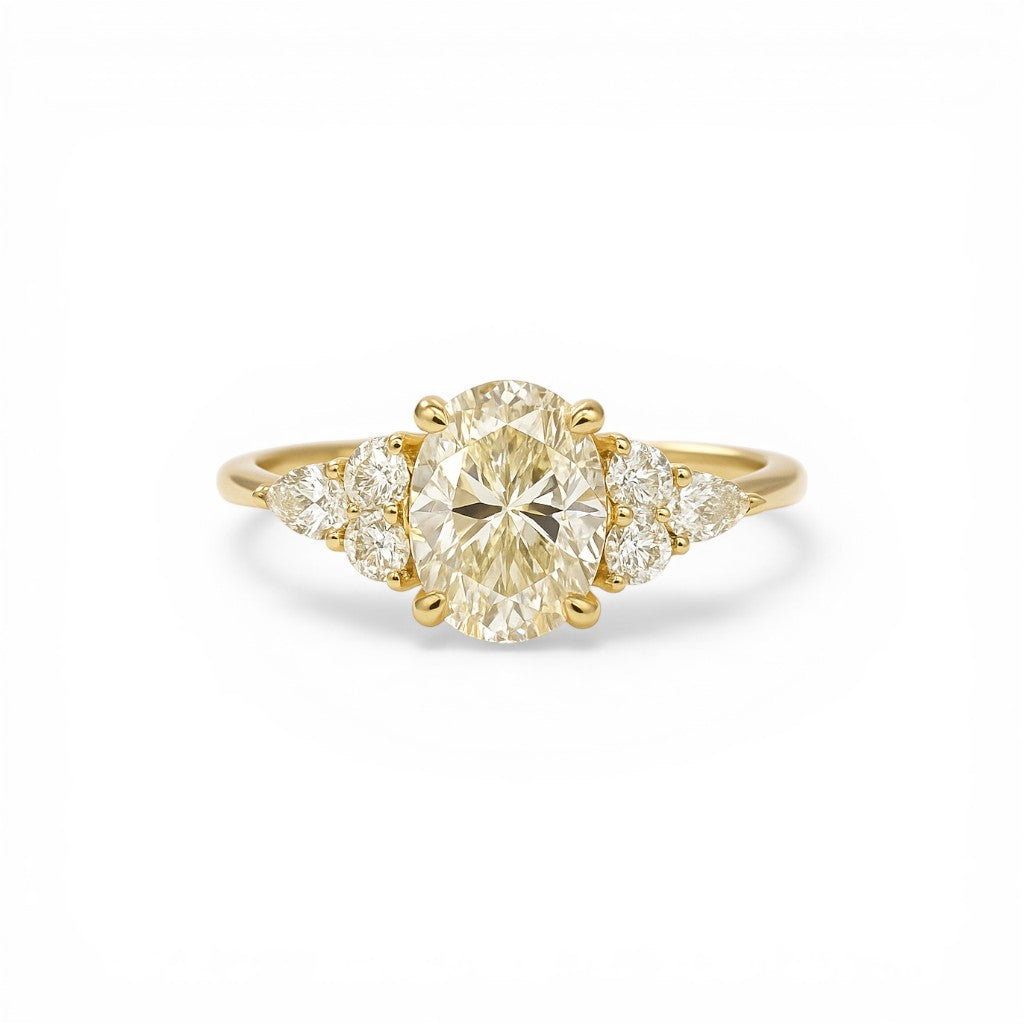 Sophia Schneider Joyas 18K yellow gold ring with a 1.08 ct oval lab-created diamond and accent navette and brilliant cut diamonds.