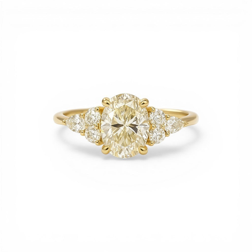 Sophia Schneider Joyas 18K yellow gold ring with a 1.08 ct oval lab-created diamond and accent navette and brilliant cut diamonds.