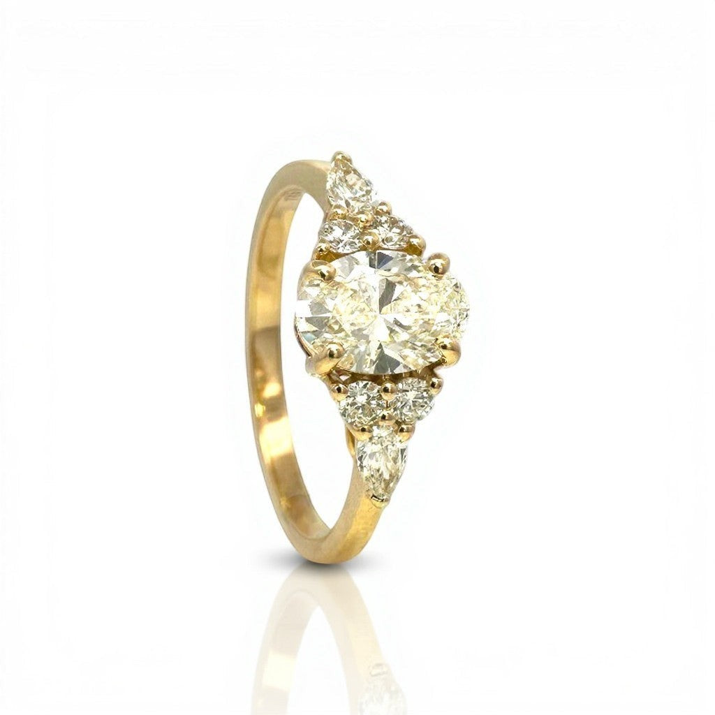 Sophia Schneider Joyas 18K yellow gold ring with 1.08 ct oval lab-created diamond and accent navette diamonds.