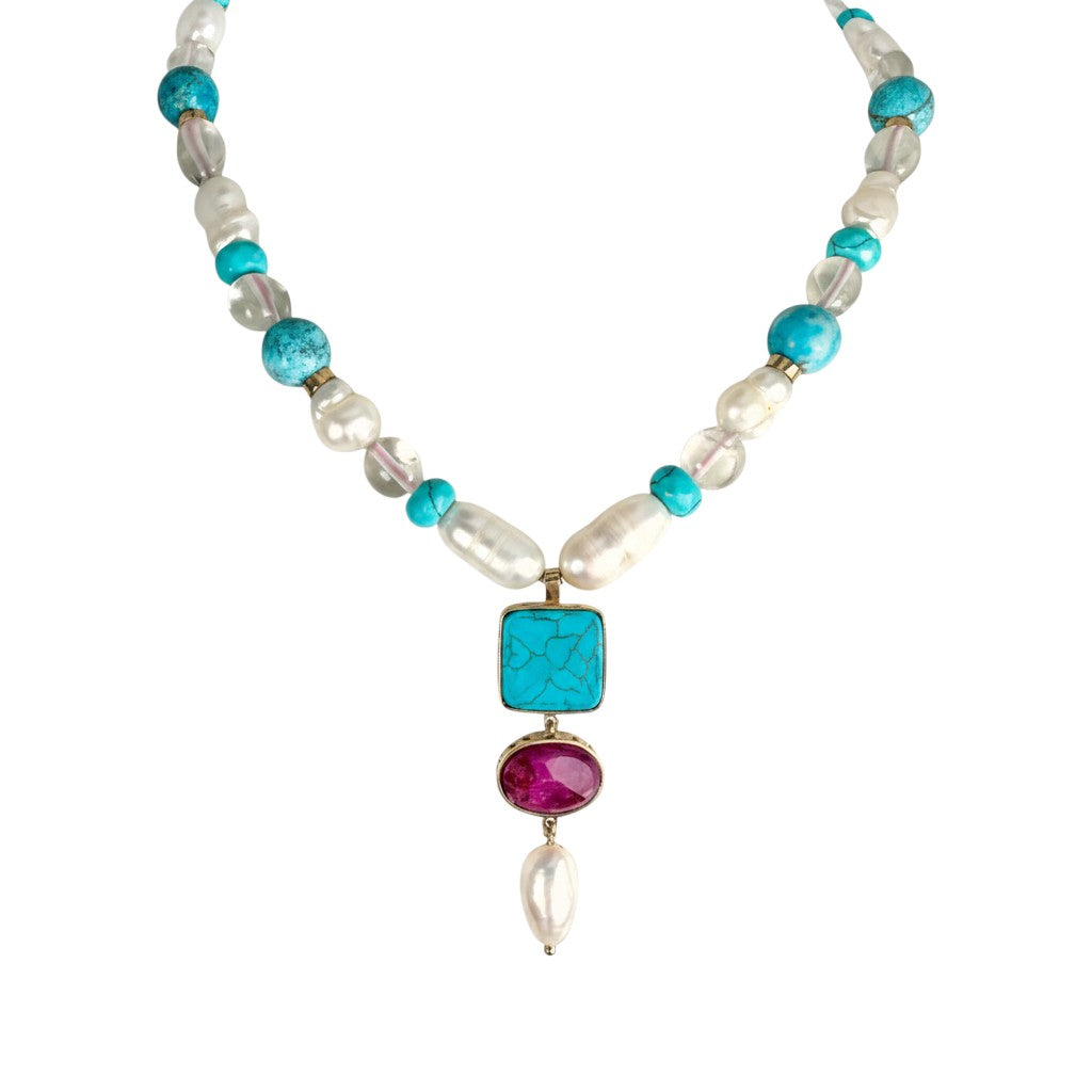 Sophia Schneider Joyas baroque pearl, turquoise, white quartz, and ruby necklace with 18K gold bezel settings.
