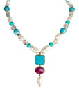 Sophia Schneider Joyas baroque pearl, turquoise, white quartz, and ruby necklace with 18K gold bezel settings.