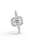 Sophia Schneider Joyas 18K white gold ring with 1.09 ct emerald-cut lab diamond surrounded by a halo and pavé band.