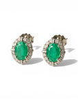 Sophia Schneider Joyas 10K gold oval emerald halo stud earrings with brilliant cut diamonds.