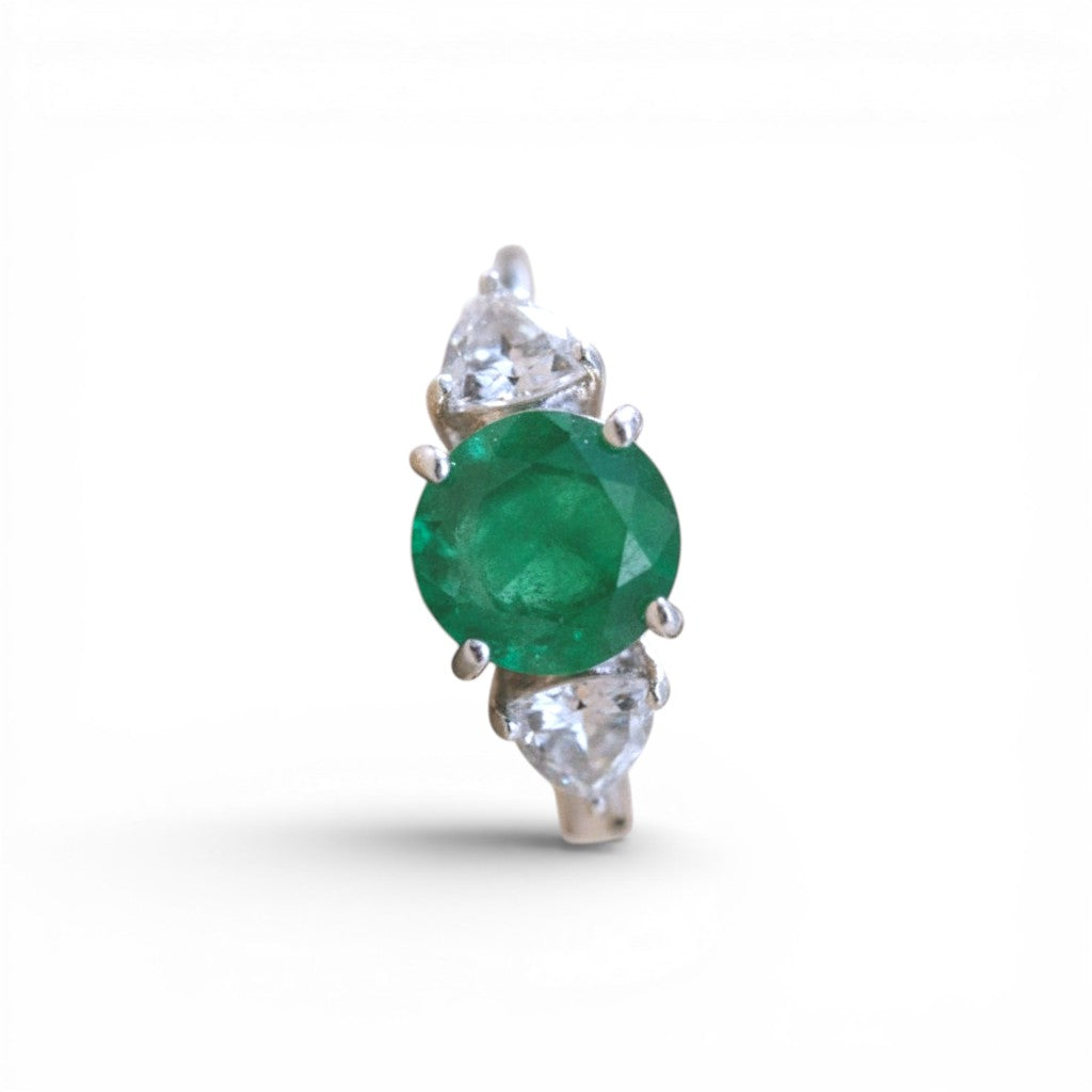 Sophia Schneider Joyas emerald and topaz ring with rhodium-plated silver. Features a 9mm round emerald and two triangular topazes.