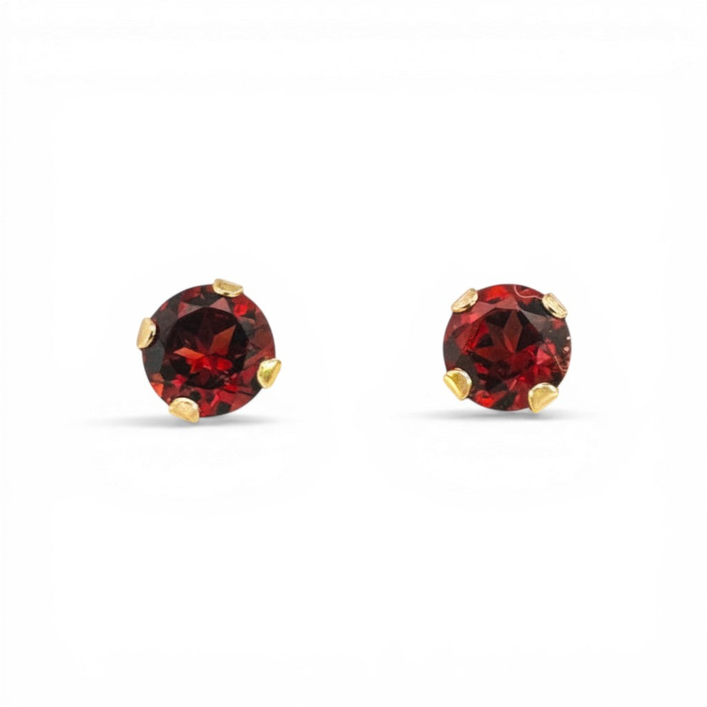 Sophia Schneider Joyas 10K gold stud earrings with 4mm round garnets set in prongs.