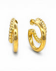 Sophia Schneider Joyas gold-plated double hoop earrings, one twisted, one smooth, 3cm diameter.