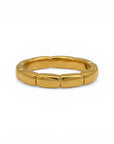 Sophia Schneider Joyas thin band ring in gold-plated sterling silver with a segmented design.
