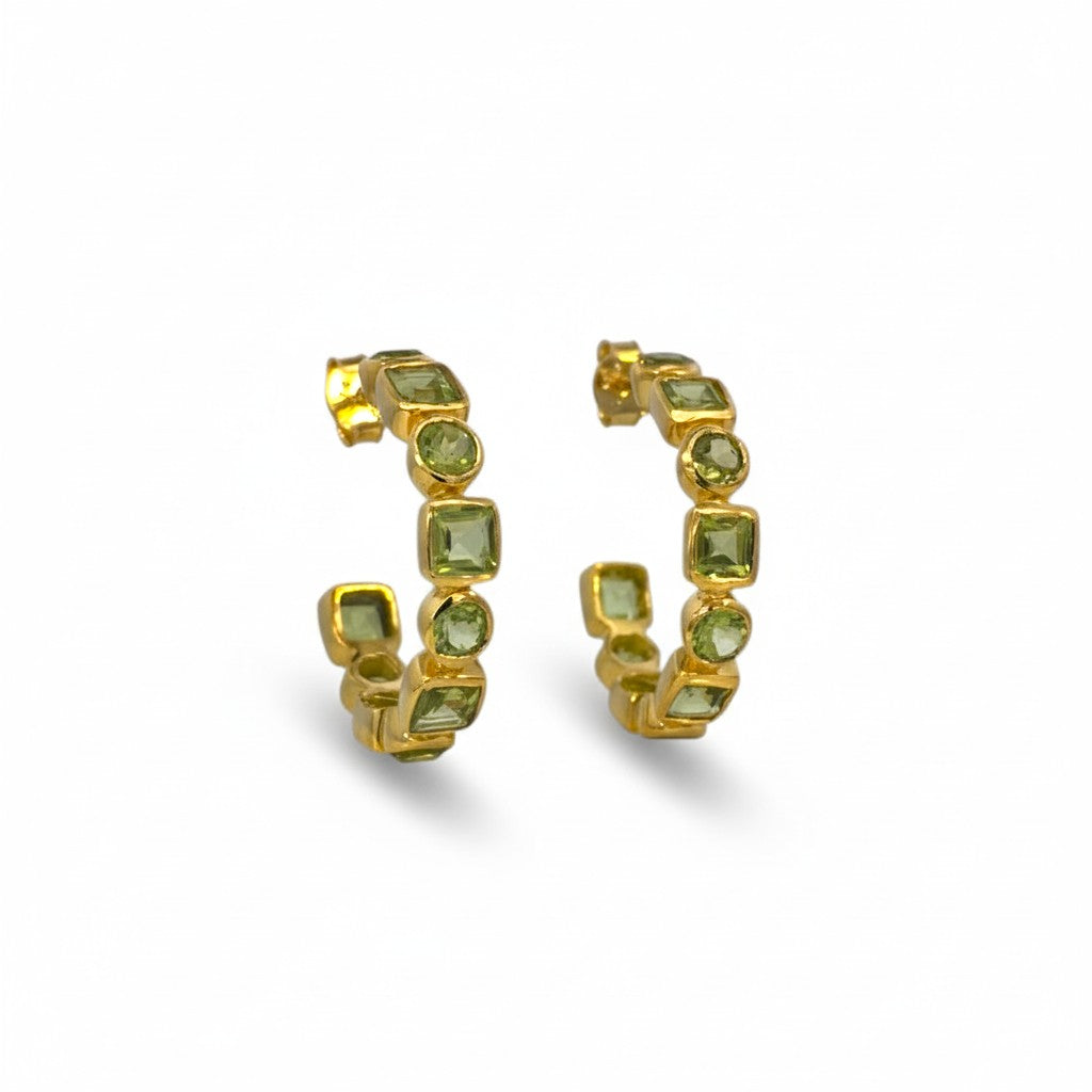 Sophia Schneider Joyas gold-plated silver hoop earrings with bezel-set prehnite stones in various cuts.