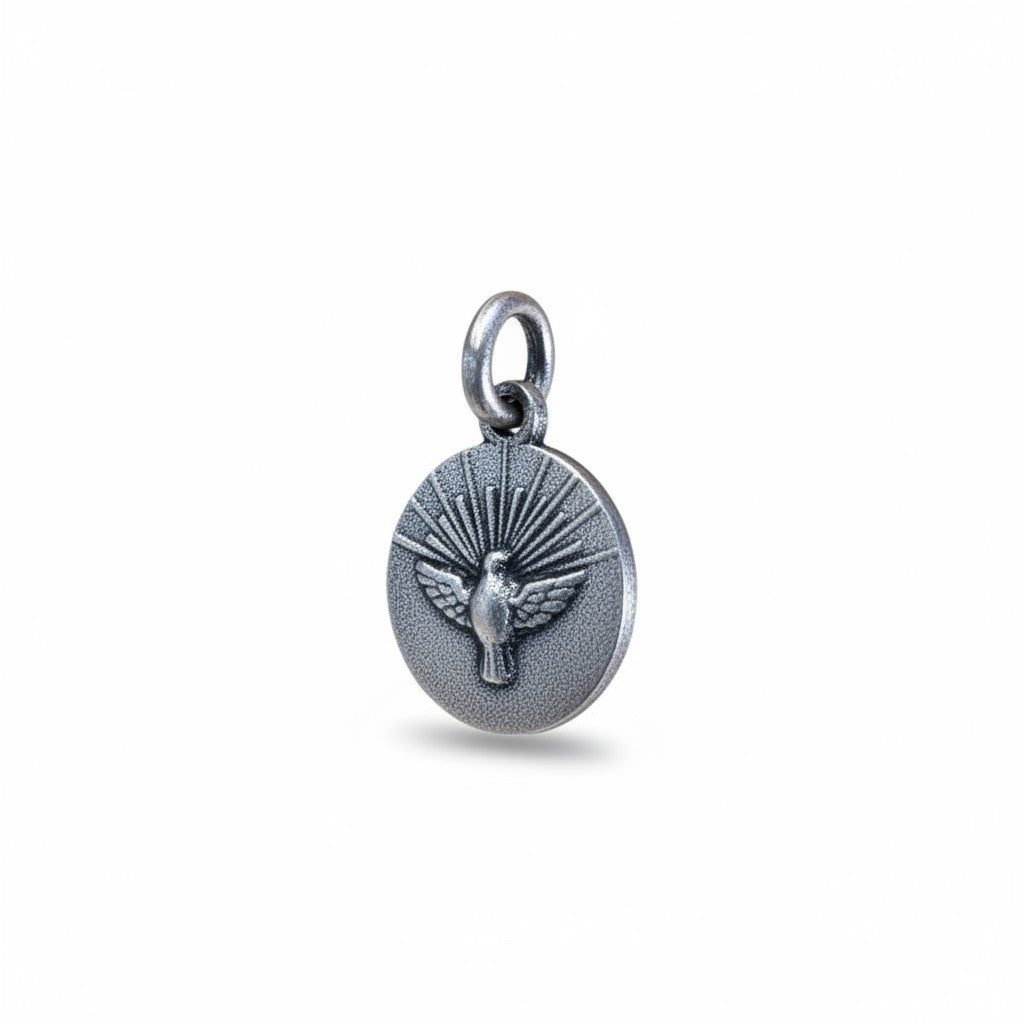 Sophia Schneider Joyas round 12mm Holy Spirit medal in sterling silver, featuring a dove with radiating rays.