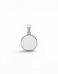 Sophia Schneider Joyas round 12mm Holy Spirit pendant in sterling silver with dove engraving.