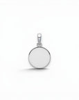 Sophia Schneider Joyas round 12mm Holy Spirit pendant in sterling silver with dove engraving.
