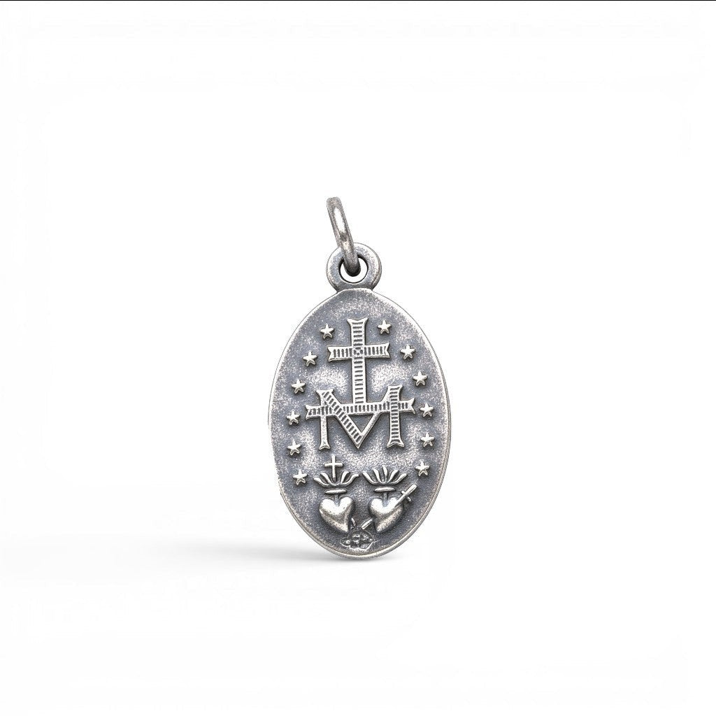 Sophia Schneider Joyas oval 16mm sterling silver medal with Virgin of the Rays and Sacred Heart design.