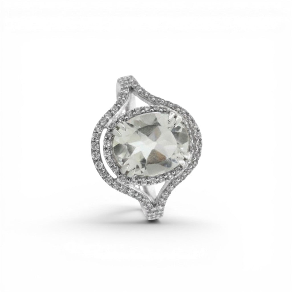 Sophia Schneider Joyas oval quartz halo ring with split shank and white topaz accents, crafted from sterling silver.