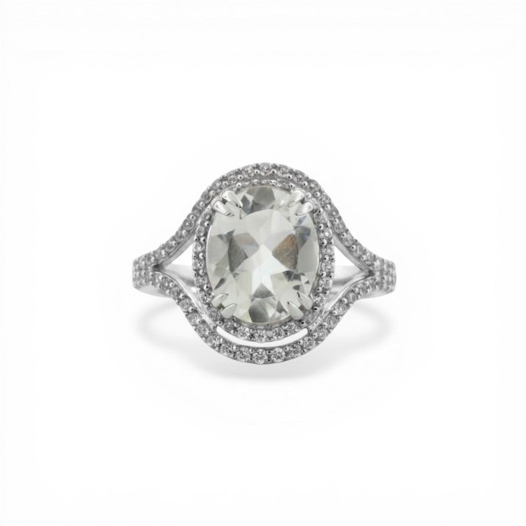 Sophia Schneider Joyas oval white quartz and topaz ring with diamond halo in sterling silver.