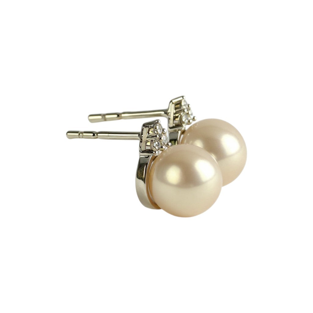 Sophia Schneider Joyas 14K white gold stud earrings with pearl and trio of brilliant-cut diamonds.