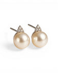 Sophia Schneider Joyas 14K white gold stud earrings with pearl and trio of brilliant-cut diamonds.