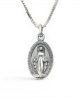 Sophia Schneider Joyas oval 16mm sterling silver medal of the Virgin of the Rays and Sacred Heart, with inscription.