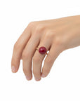 Sophia Schneider Joyas rose gold plated silver ring with a red garnet stone.