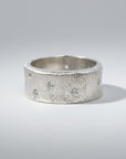 Sophia Schneider Joyas textured silver band ring with scattered cubic zirconia stones.