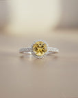 Sophia Schneider Joyas silver ring with a 1.65 ct round yellow citrine center stone surrounded by small white stones.