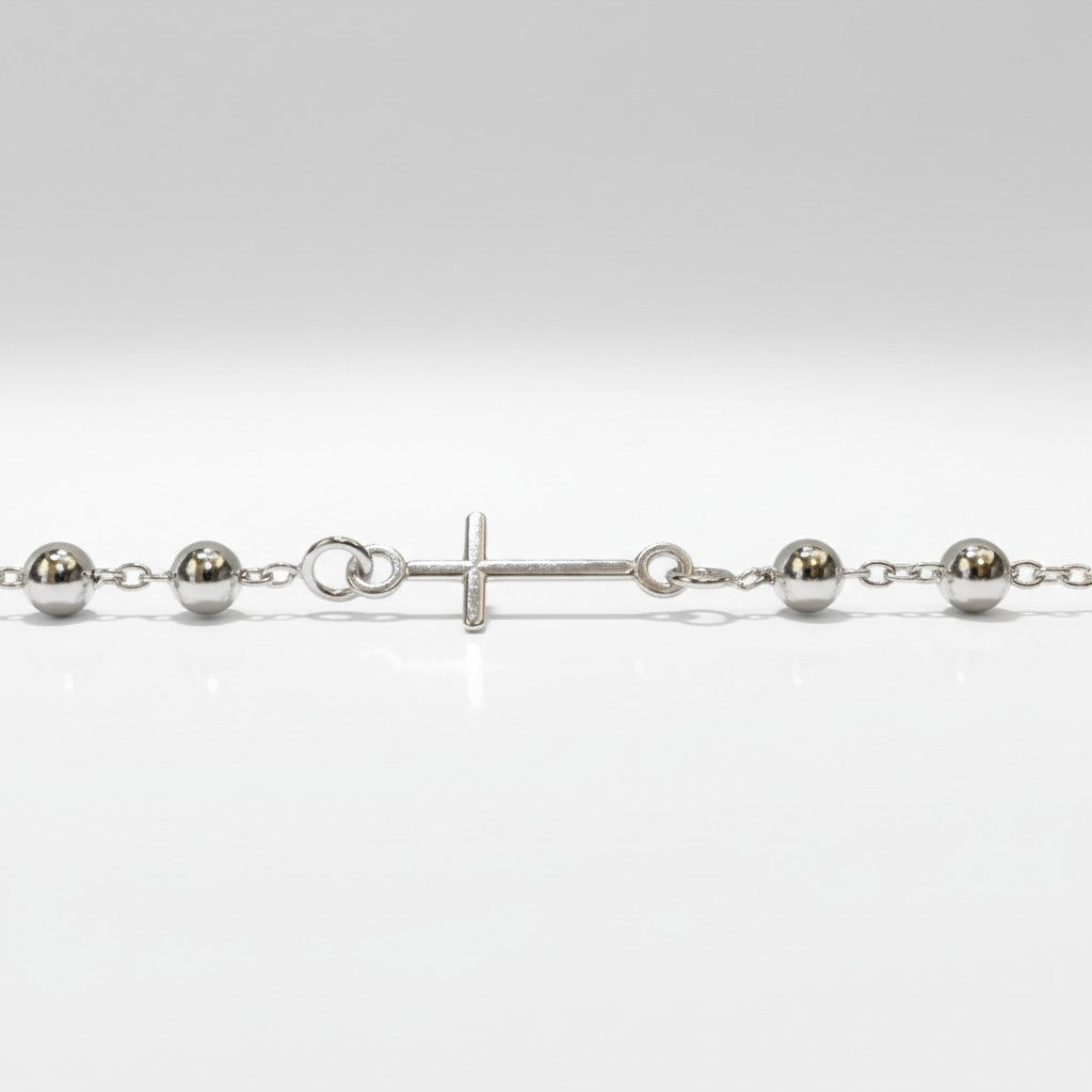 Sophia Schneider Joyas silver 925 chain bracelet with small beads and a cross charm. Adjustable length 18-20cm.
