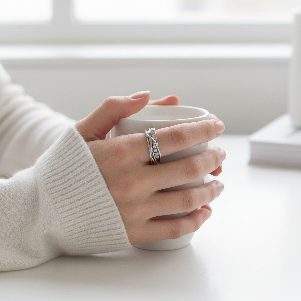 Sophia Schneider Joyas silver rhodium-plated ring with multiple intertwined bands and small square-cut diamonds.
