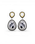 Sophia Schneider Joyas silver earrings with white and black marbled stone, surrounded by clear and black crystals.