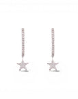 Sophia Schneider Joyas sterling silver hoop earrings with dangling star charms, encrusted with lab-created diamonds.