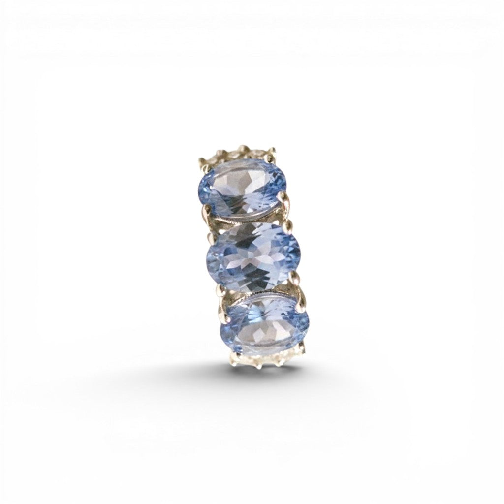 Sophia Schneider Joyas sterling silver ring with three oval blue tanzanite and topaz stones.