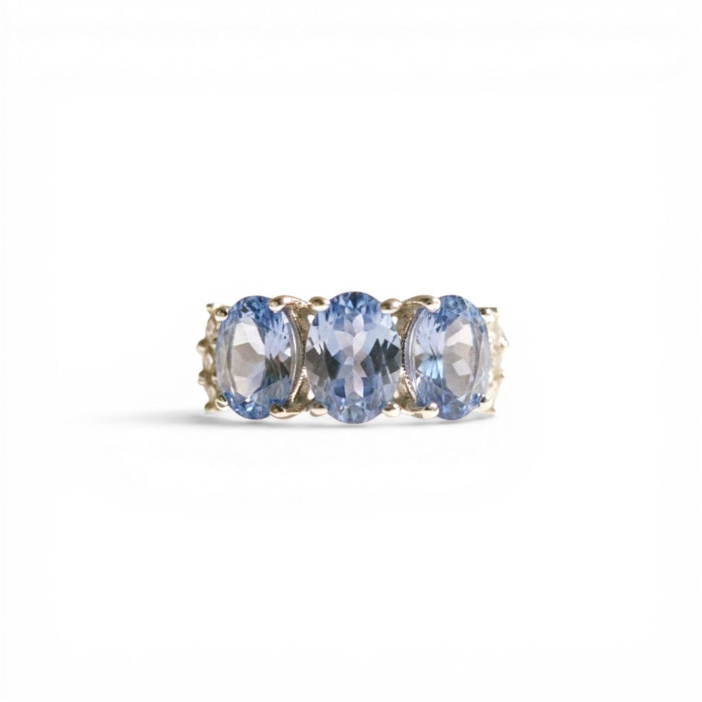 Sophia Schneider Joyas sterling silver ring with three oval blue tanzanite and topaz stones.
