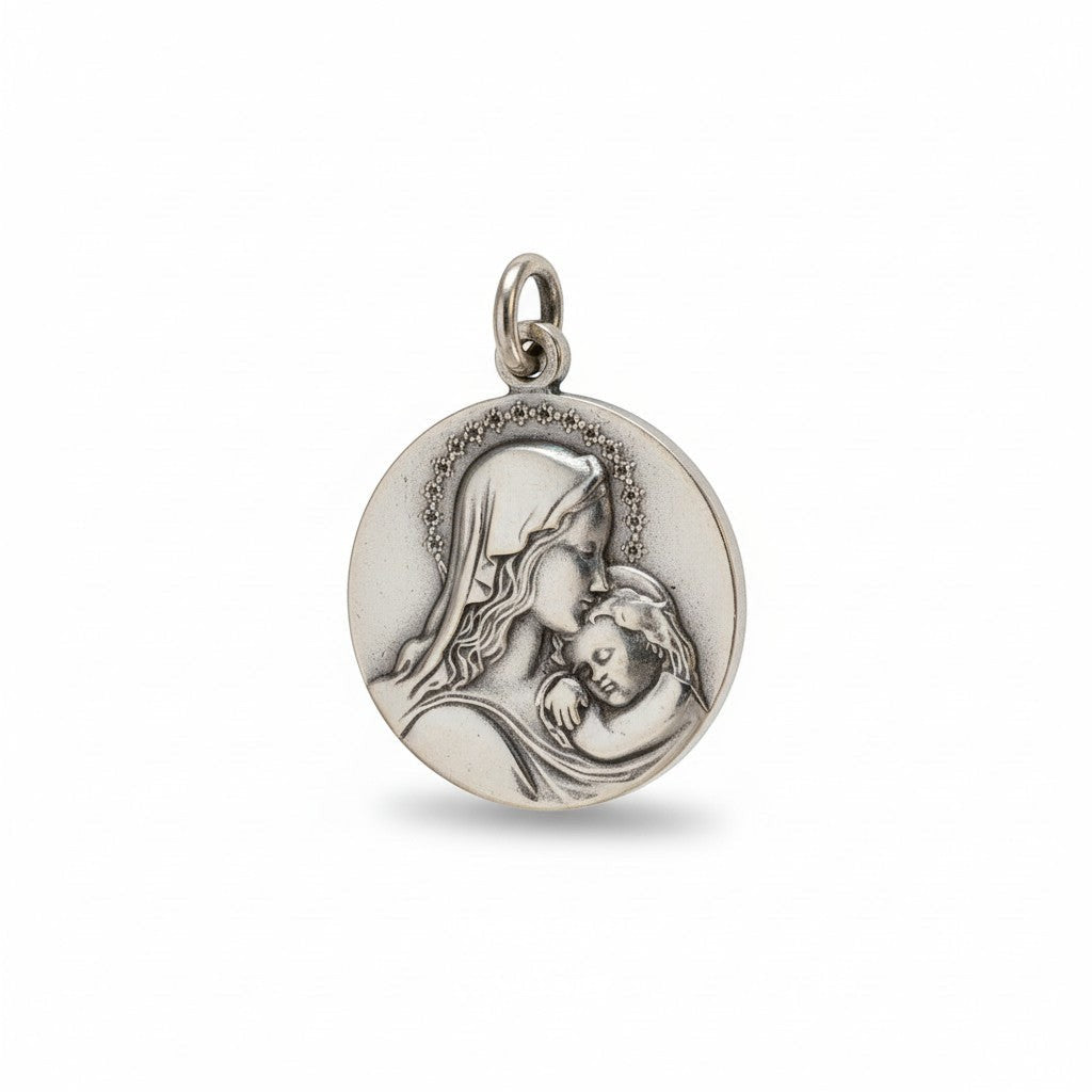 Sophia Schneider Joyas round 25mm sterling silver Mariana medal with cubic zirconia halo detail.