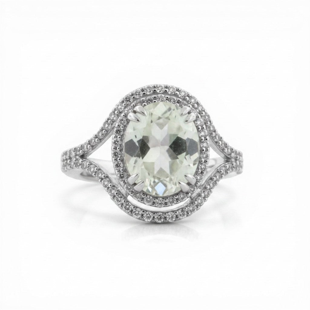 Sophia Schneider Joyas oval white quartz and topaz ring with diamond halo and silver band.