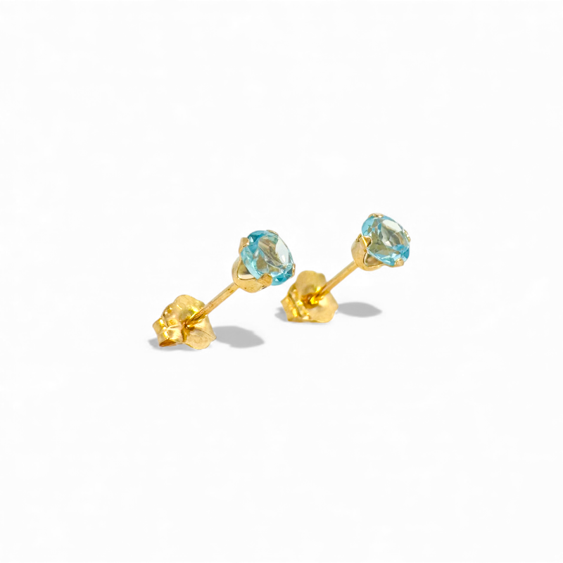 Aros stud topacio azul en grifa oro 10K