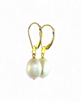 Aros colgantes perla oval en oro 14K